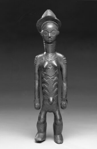 Female figure carved from wood